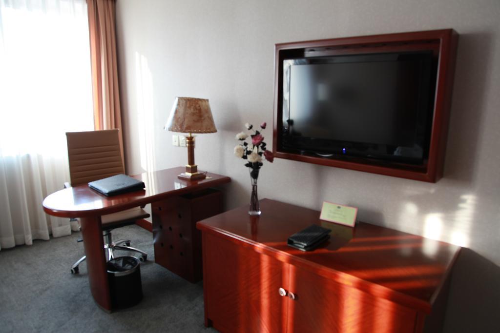 New Gloria Plaza Garden Hotel Харбин Стая снимка