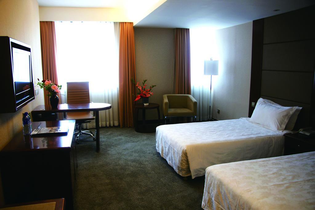 New Gloria Plaza Garden Hotel Харбин Стая снимка