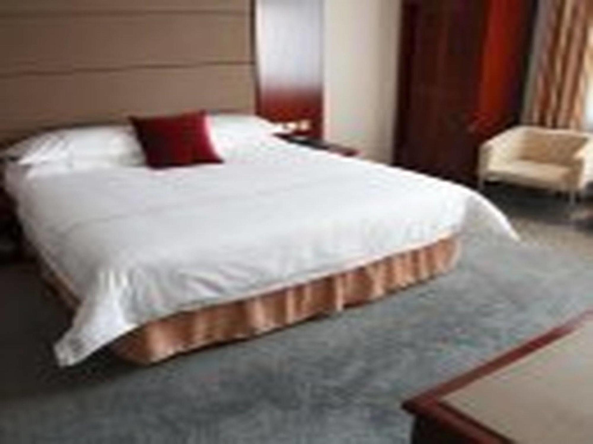 New Gloria Plaza Garden Hotel Харбин Екстериор снимка